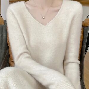 Ivory100% wool v neck sweater, medium, $35.